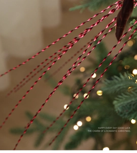 Close-up of bright red spiral Christmas tree picks with glossy finish and festive glow