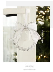 Close-up of a 11.5cm crystal bead Christmas wreath ornament with a Merry Christmas ribbon