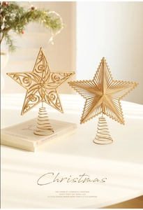 Detailed view of hollow champagne gold tree topper stars with spiral metal base