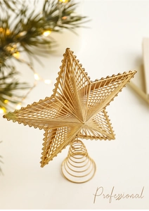 Close-up of golden hollow five-pointed star tree topper with spiral metal base