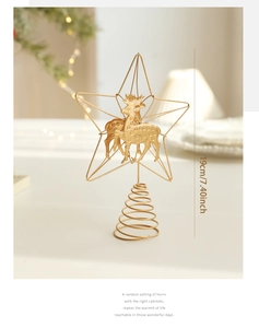 Detailed view of 19cm golden star tree topper with reindeer motif and spiral base