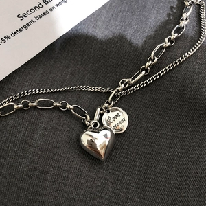 Detail of S925 silver double-layer necklace with heart pendant and Love Forever engraving