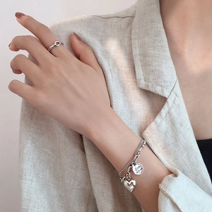 Detail of S925 silver double-layer bracelet with heart charm and Love forever engraving
