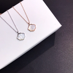 Detailed comparison of shell pendant necklaces in silver and rose gold finishes