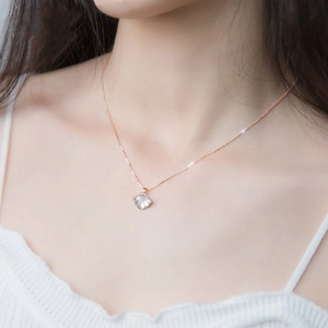 Elegant sterling silver shell pendant necklace with mother of pearl on a rose gold chain