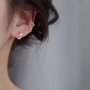 Detail view of S925 sterling silver heart zircon earring and minimalist double-loop ear cuff
