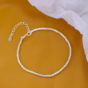Macro shot of silver sparkling double-layer bracelet with adjustable clasp detail