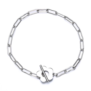 Silver metallic chain bracelet with floral toggle clasp design in a minimalist style