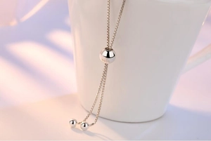 Macro shot of S925 sterling silver slider bead with hallmark on a box chain bracelet