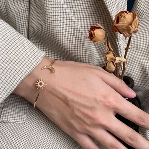 Elegant gold S925 silver celestial bracelet with sparkling sun and moon charms for women