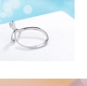 Macro view of S925 sterling silver inner band with clear purity hallmark and opal inlay