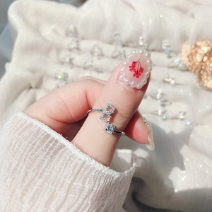 Detailed view of adjustable silver letter B ring with sparkling cubic zirconia stone
