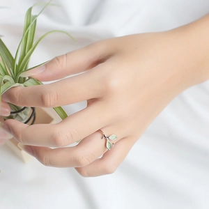 Minimalist s925 silver open leaf ring with green enamel accents on model hand