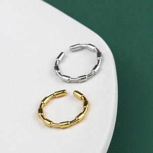 Detailed close-up of S925 sterling silver bamboo style open rings in gold and silver