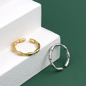 Bamboo style open rings in gold and silver finish with S925 hallmark on white steps