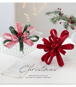 Luxurious velvet Christmas bow decoration with red berries for festive home tree decor