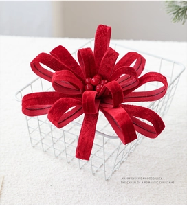 Detailed view of luxury red velvet Christmas flower ornament with beaded center decor