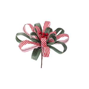 Christmas striped ribbon bow with red berries and velvet leaves on a decorative floral pick