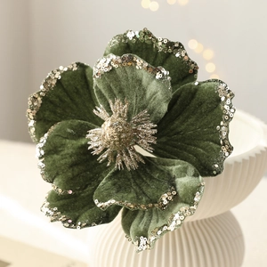 Luxurious dark green velvet magnolia flower with gold sequins for Christmas decoration