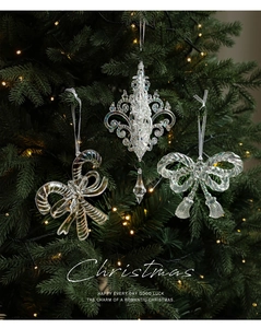 Iridescent acrylic Christmas tree ornaments with candy cane and fleur-de-lis shapes