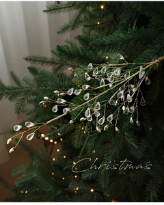 Detail of Christmas tree pick with gold wire branches and teardrop crystal bead ornaments