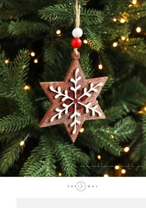 Detail of star-shaped wooden Christmas ornament with snowflake pattern and colorful beads