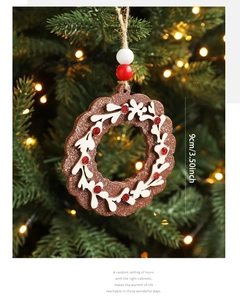 Detailed view of a 9cm wooden Christmas gingerbread wreath with red glitter and jute rope