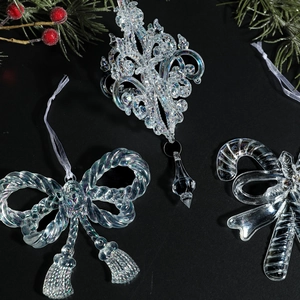 Set of iridescent acrylic Christmas tree ornaments with bow and candy cane shapes
