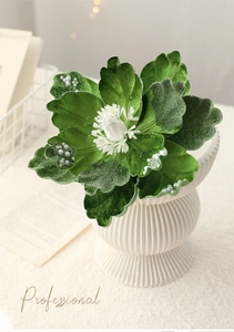 Detailed close-up of velvet magnolia with white pearls and striped white base