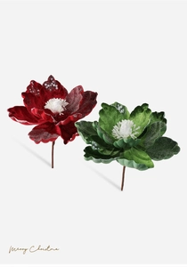 Detail of red and green velvet Christmas flowers with snow effect and pearl accents