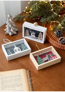 Macro detail of wooden Christmas shadow boxes with carved reindeer and pine trees