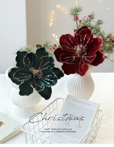 Detailed view of luxury velvet magnolia flowers with gold glitter for Christmas decor