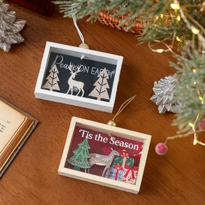 3D wooden Christmas hanging shadow boxes featuring reindeer and pine tree festive scenes