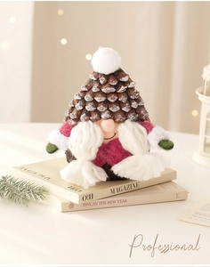 Macro detail of Christmas gnome doll with pine cone hat and braided white yarn beard