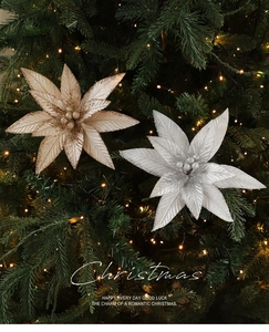 Close-up of champagne gold and silver glitter artificial flowers on a Christmas tree