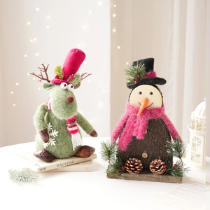 Christmas reindeer and snowman tabletop figurines with felt and wood textures in festive setting