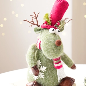 Christmas plush reindeer figurine in green with red hat and scarf for holiday decor