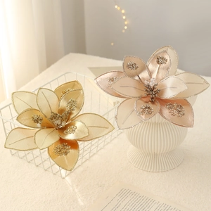 Champagne and rose gold artificial Christmas flowers with glitter on white basket