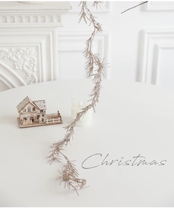 Champagne gold Christmas garland with glitter finish used for holiday wall decoration