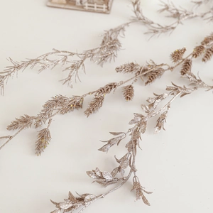 Artificial champagne gold glitter branches for elegant Christmas tree decorations