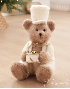 Close-up of a teddy bear plush ornament with drum in vintage British style felt