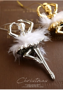 Close-up of ballet dancer Christmas ornaments with white feathers and metallic finish