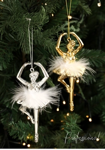 Close-up of gold and silver ballet girl ornaments with feather skirts on Christmas tree