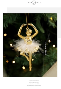 Detailed close-up of a 12.5cm gold ballet dancer Christmas ornament with white feathers