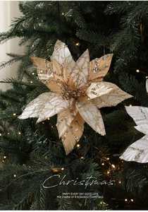 Sparkling gold and silver 28cm Christmas artificial flower on a tree with LED lights
