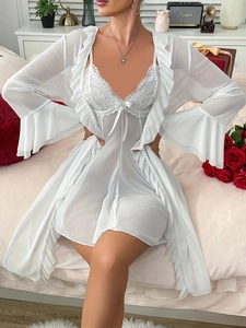 Close-up of white lace lingerie set featuring ruffled sleeve detail and floral lace trim