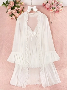 Detailed view of white lace lingerie set featuring mesh nightgown and matching cardigan