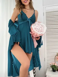 Close-up of dark teal lace-trimmed satin nightgown and matching robe set for women