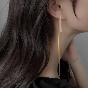 Elegant gold S925 silver long tassel earrings with sparkling diamonds on model