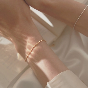 Minimalist 925 sterling silver geometric square link bracelet shown on wrist with golden finish